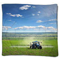Farming Tractor Plowing And Spraying On Field Vertical Blankets 14681164