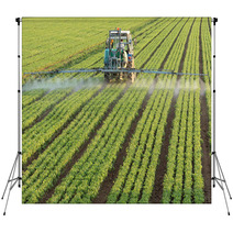 Farming Tractor Spaying A Field Backdrops 16325792