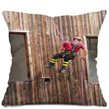 Firefighter Climber Down Into The Wall Of The House In Abseiling Pillows 65583718