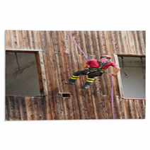 Firefighter Climber Down Into The Wall Of The House In Abseiling Rugs 65583718