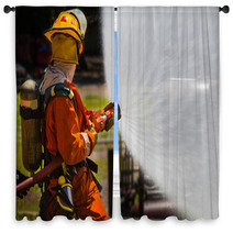 Firefighter Fighting For A Fire Attack During A Training Window Curtains 65688077