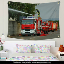 Firefighters With The Fire Truck When Switching Off A Fire Wall Art 54074147