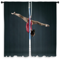 Flexible Girl Performs Trick With Hanging Hoop Window Curtains 85706538