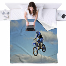 Flight Of Biker Motocross Against The Blue Sky And Clouds Blankets 46705772