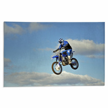 Flight Of Biker Motocross Against The Blue Sky And Clouds Rugs 46705772