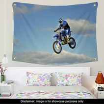 Flight Of Biker Motocross Against The Blue Sky And Clouds Wall Art 46705772