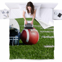 Football And Helmet On The Field Blankets 42014628