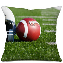 Football And Helmet On The Field Pillows 42014628