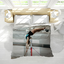 Girl Athlete Gymnast Exercises On Uneven Bars Bedding 136677938