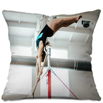 Girl Athlete Gymnast Exercises On Uneven Bars Pillows 136677938