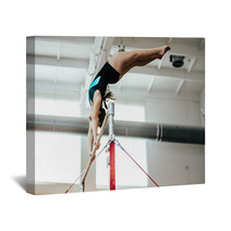 Girl Athlete Gymnast Exercises On Uneven Bars Wall Art 136677938