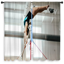 Girl Athlete Gymnast Exercises On Uneven Bars Window Curtains 136677938