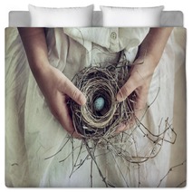 Girl Holding Blue Speckled Egg In Bird Nest On Lap Bedding 64772362