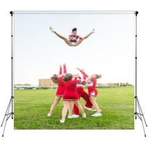 Group Of Cheerleaders Performing Stunts Backdrops 60003568