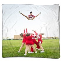 Group Of Cheerleaders Performing Stunts Blankets 60003568