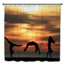 Group Of Gymnasts Tumbling In Sunset Bath Decor 48042586
