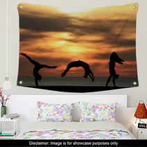 Group Of Gymnasts Tumbling In Sunset Wall Art 48042586