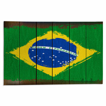 Grunged Brazilian Flag Over A Wooden Plank Background Rugs 55825385