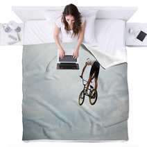 Guy Jumps On Bike Blankets 55251710