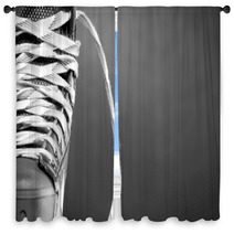 Half Of A Hockey Skate On Black Window Curtains 79923796
