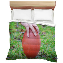 Hand On Rugby Ball On Green Grass Background Bedding 60202151