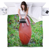 Hand On Rugby Ball On Green Grass Background Blankets 60202151