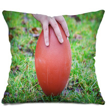 Hand On Rugby Ball On Green Grass Background Pillows 60202151