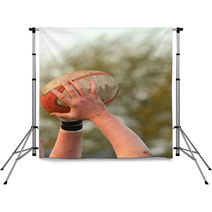 Hands Holding A Rugby Ball Backdrops 61889606