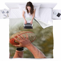 Hands Holding A Rugby Ball Blankets 61889606