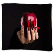 Hands With Scary Nails Manicure Holding Poisoned Red Apple Isolated On Black Background Blankets 135127741
