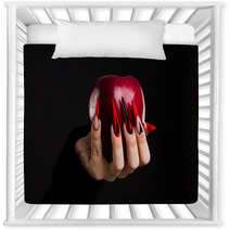 Hands With Scary Nails Manicure Holding Poisoned Red Apple Isolated On Black Background Nursery Decor 135127741