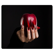 Hands With Scary Nails Manicure Holding Poisoned Red Apple Isolated On Black Background Rugs 135127741