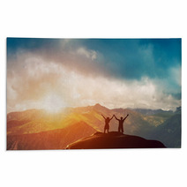 Happy Couple Together On The Peak Of A Mountain At Sunset Rugs 62334764
