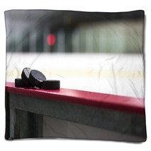 Hockey Pucks Resting On The Boards Blankets 123980919