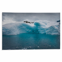 Iceberg Drifting In The Aquamarine Sea Of Antarctica Rugs 45051661