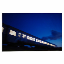Illuminated Train Traveling Past At Night Rugs 63092536