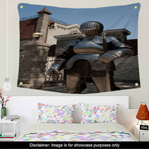 Knight In The Ancient Metal Armor Standing Near The Stone Wall Wall Art 66227892