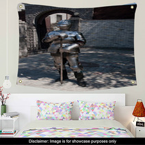 Knight In The Ancient Metal Armor Standing Near The Stone Wall Wall Art 66227995