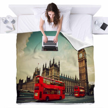 London, The UK. Red Bus In Motion And Big Ben Blankets 61905706