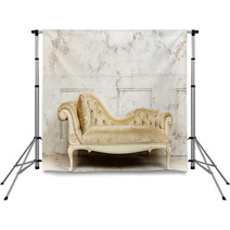 Luxurious Golden Sofa On A Background Of Old White Wall Backdrops 136055200