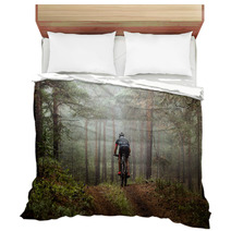 Male Athlete Mountainbiker Rides A Bicycle Along A Forest Trail In Forest Mist Mysterious View Bedding 117998340
