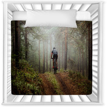 Male Athlete Mountainbiker Rides A Bicycle Along A Forest Trail In Forest Mist Mysterious View Nursery Decor 117998340