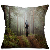 Male Athlete Mountainbiker Rides A Bicycle Along A Forest Trail In Forest Mist Mysterious View Pillows 117998340