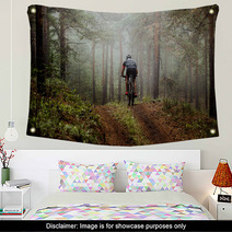 Male Athlete Mountainbiker Rides A Bicycle Along A Forest Trail In Forest Mist Mysterious View Wall Art 117998340