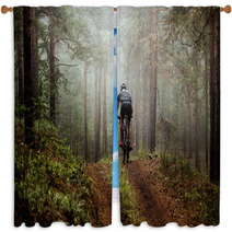 Male Athlete Mountainbiker Rides A Bicycle Along A Forest Trail In Forest Mist Mysterious View Window Curtains 117998340
