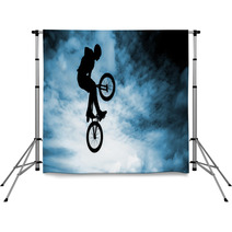 Man Doing An Jump With A Bmx Bike Over Blue Sky Background Backdrops 58094528