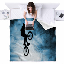 Man Doing An Jump With A Bmx Bike Over Blue Sky Background Blankets 58094528