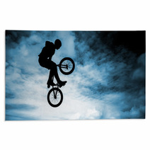 Man Doing An Jump With A Bmx Bike Over Blue Sky Background Rugs 58094528