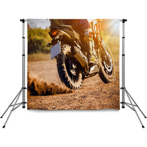 Man Extreme Riding Touring Enduro Motorcycle On Dirt Field Backdrops 136884886