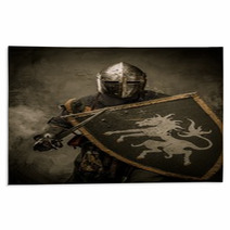 Medieval Knight With Sword And Shield Against Stone Wall Rugs 48836901
